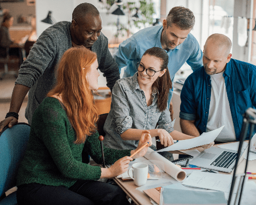 A group of diverse professionals engaged in a strategic discussion